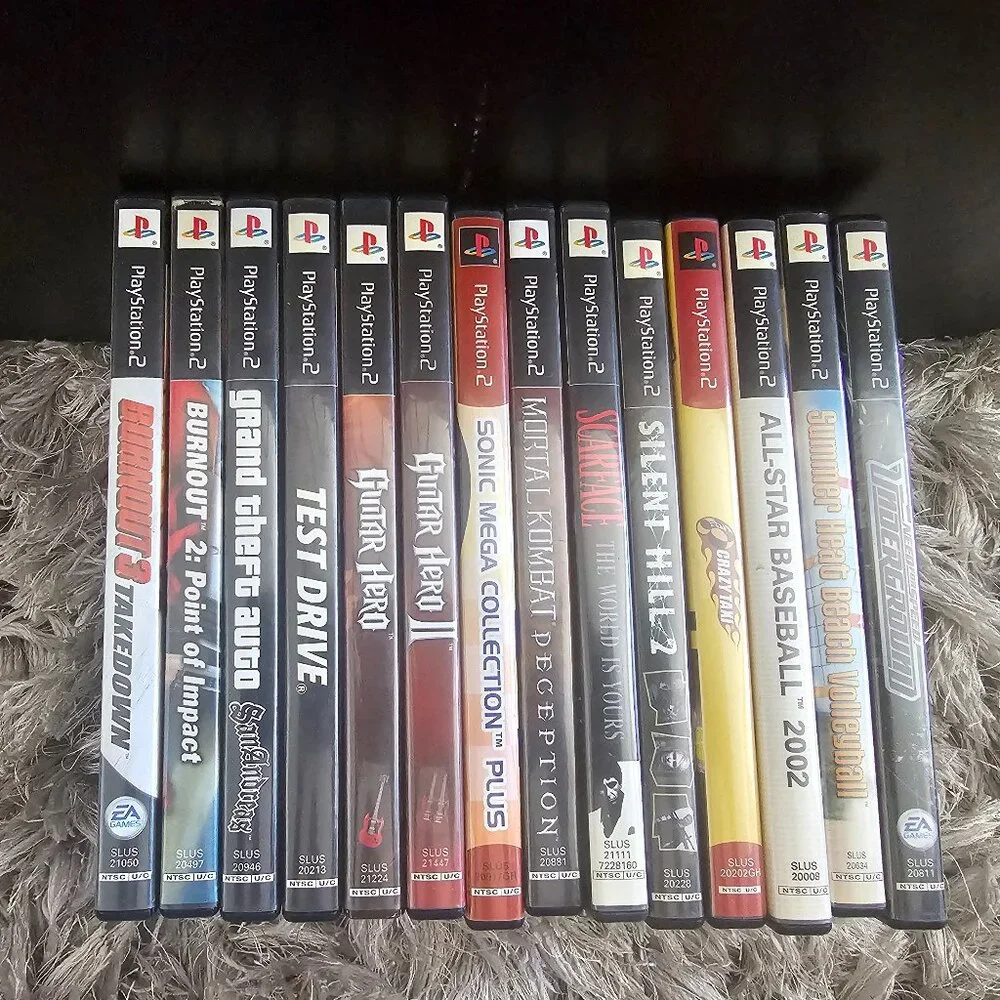 Playsation 2 (PS2 Fat) with controllers and games and PS2 Slim